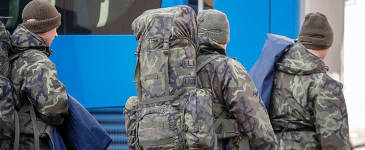A charter bus drives for military